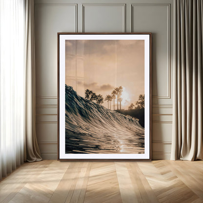 Golden sunset view of an ocean wave curling near palm trees, radiating warm tones perfect for coastal or tropical-themed decor.