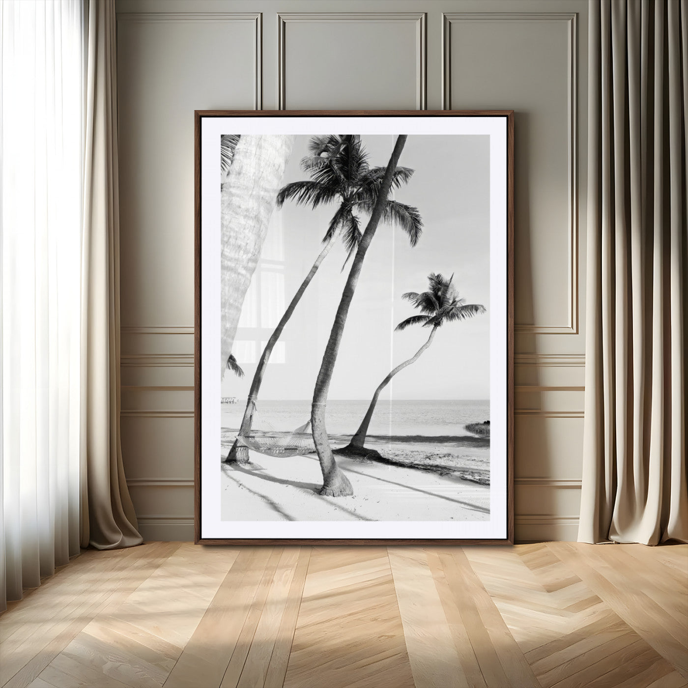 Black and white wall art of palm trees and a hammock on a beach, ideal for coastal minimalist or tropical-themed decor.