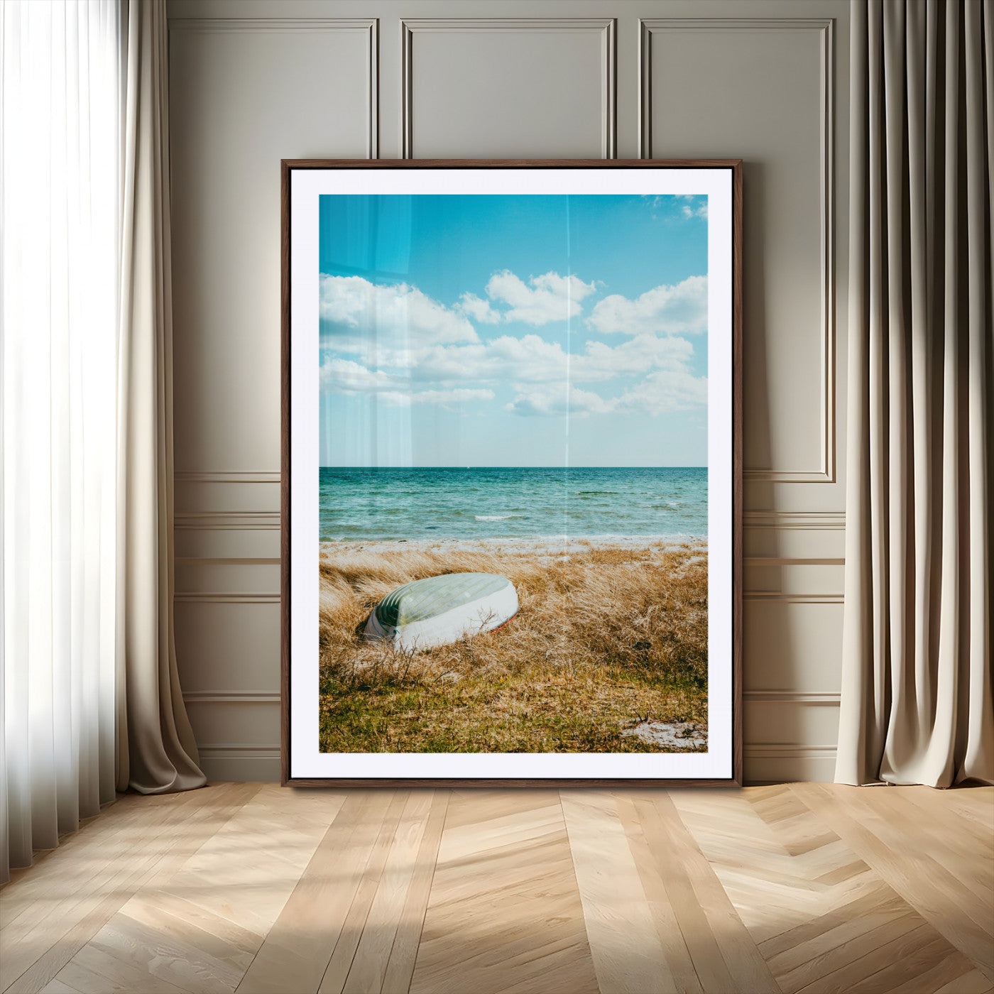A small boat resting on a grassy shore with ocean waves and a bright blue sky, creating a peaceful coastal atmosphere.