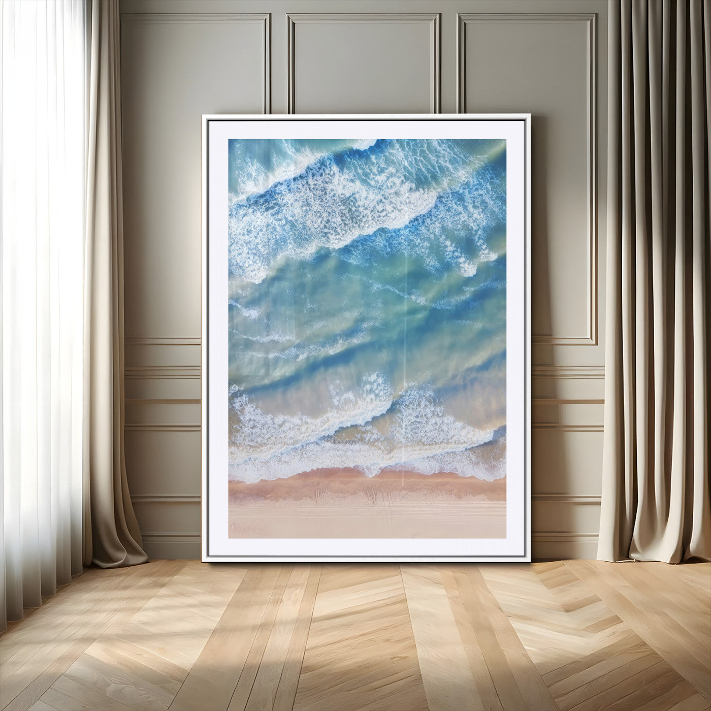 Aerial photo of soft blue waves meeting sandy shore, perfect for modern coastal or beach-themed decor with a light and tranquil aesthetic.