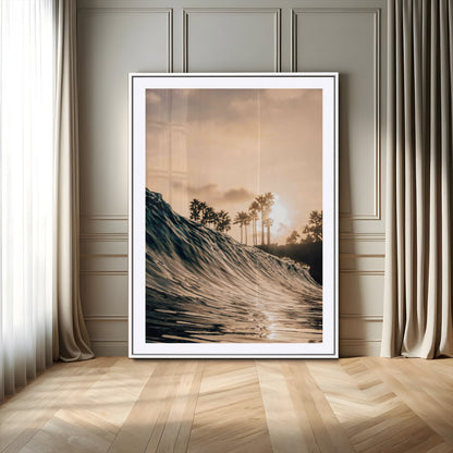 Golden sunset view of an ocean wave curling near palm trees, radiating warm tones perfect for coastal or tropical-themed decor.