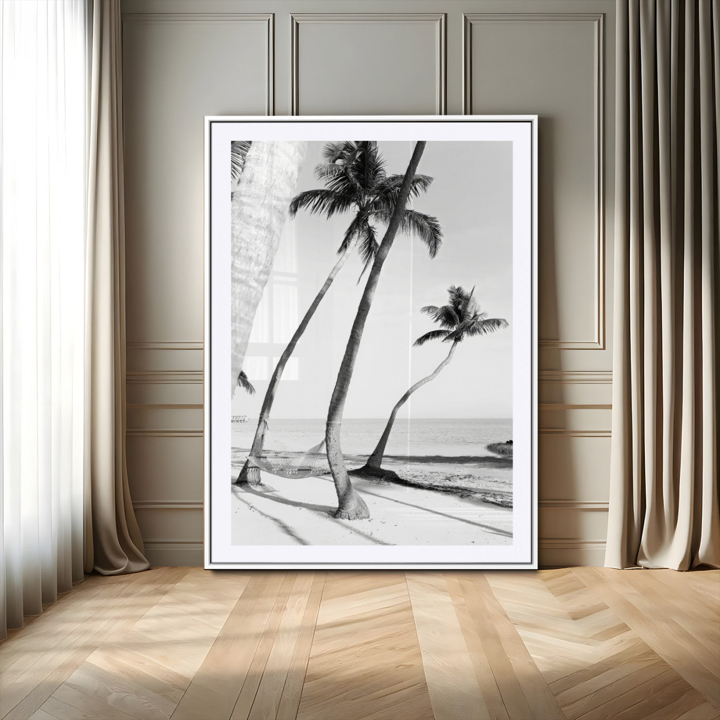 Black and white wall art of palm trees and a hammock on a beach, ideal for coastal minimalist or tropical-themed decor.