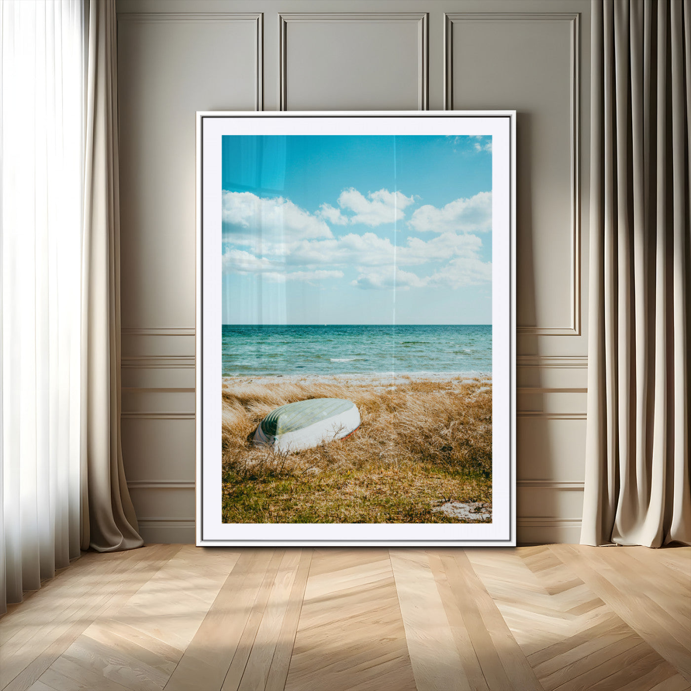 A small boat resting on a grassy shore with ocean waves and a bright blue sky, creating a peaceful coastal atmosphere.