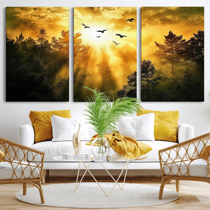 Canvas of a golden forest at sunset with birds flying through glowing sunbeams and silhouetted pine trees, ideal for warm-toned rustic decor.