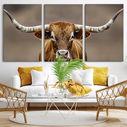 Close-up of a Texas Longhorn with strong curved horns and warm brown tones, perfect for rustic or western-style wall decor.