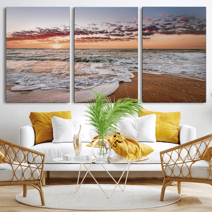 Canvas of a sunset over a foamy ocean shore with warm light and gentle waves, ideal for coastal or beach-themed home decor.