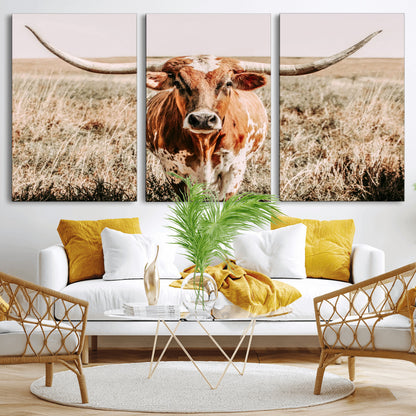 Framed longhorn cow canvas wall art with rustic prairie background, western animal print perfect for farmhouse or ranch style decor