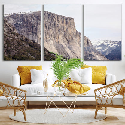 Framed canvas of El Capitan’s vertical granite face in Yosemite with snowy peaks, ideal for Sierra minimalism or mountain-inspired decor.