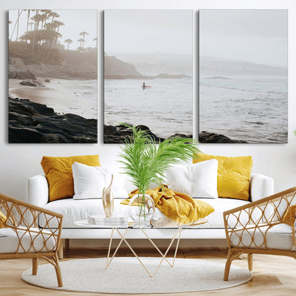 Framed canvas of a surfer in misty coastal tones at a foggy California beach, ideal for minimalist coastal beach or serene ocean-themed decor.
