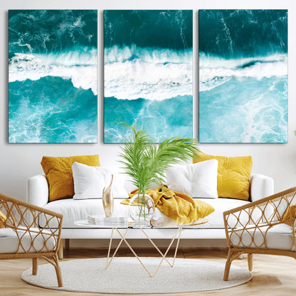 Aerial view of turquoise ocean waves crashing with white foam, perfect for tropical coastal or modern beach-style home decor.