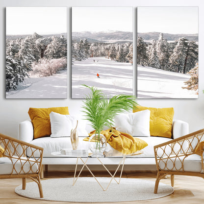 Bright ski trail lined with snow-covered pines and a skier in orange, perfect for alpine adventure or winter sports-inspired decor.