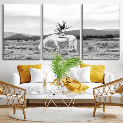 Black and white photo of a woman on a white horse in moody tones, ideal for Western Boho or modern rustic-style home decor.