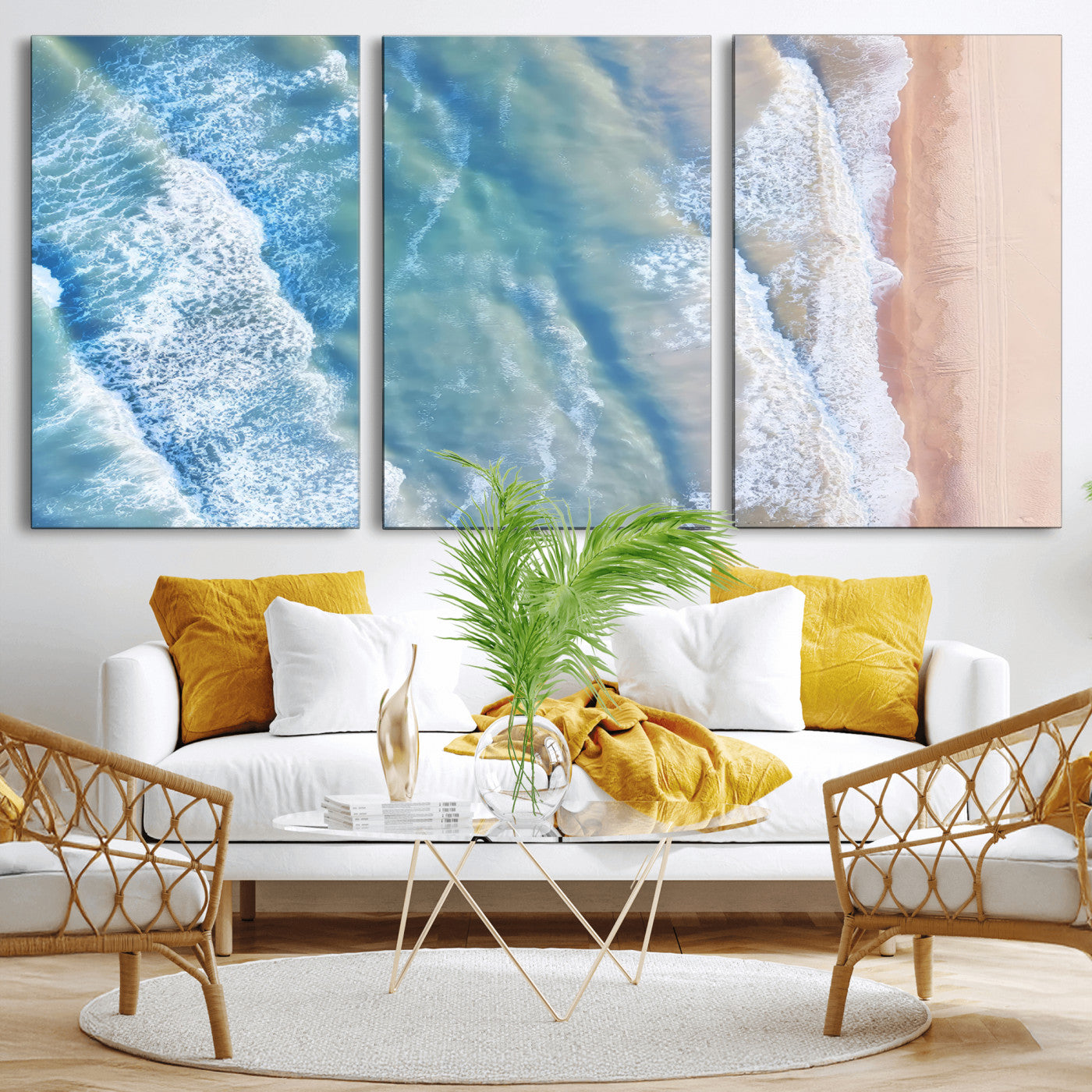 Aerial photo of soft blue waves meeting sandy shore, perfect for modern coastal or beach-themed decor with a light and tranquil aesthetic.