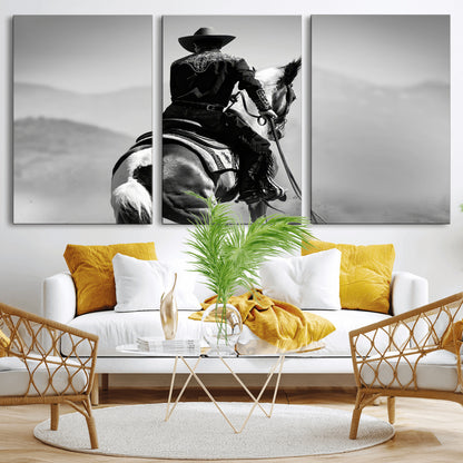 Black and white canvas of a cowboy on horseback with moody tones, perfect for rustic western or country-inspired home decor.