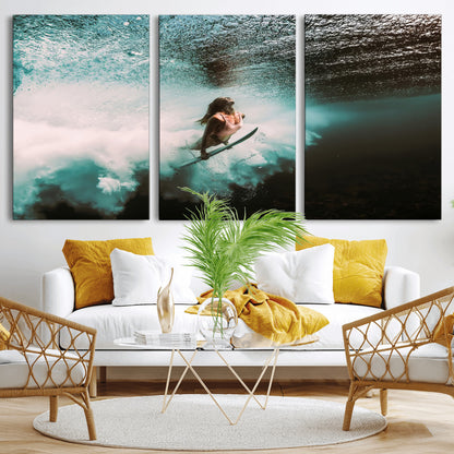 Vibrant underwater photo of a female surfer diving through turquoise waves, perfect for coastal boho or surf-inspired home decor.