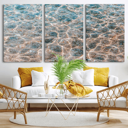 Close-up of sunlit ocean ripples with aqua blue and golden tones, ideal for modern coastal or minimalist home decor.