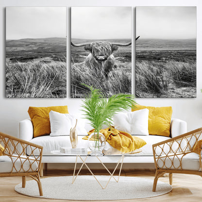 A black and white portrait of a Highland cow in a foggy Scottish countryside, capturing a rustic aesthetic and tranquil farm escape.