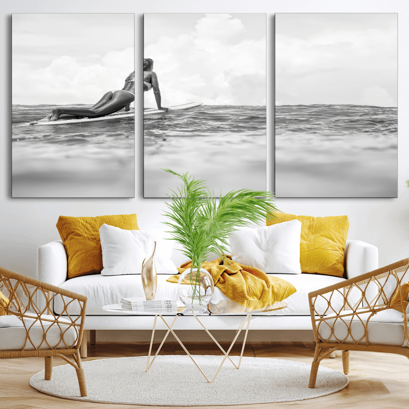A black and white ocean scene featuring a surfer girl waiting on her board, gazing at the horizon, capturing a tranquil and adventurous coastal moment.