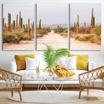 A desert road lined with saguaro cacti under a golden sky, creating a warm southwestern feel, perfect for boho or rustic decor.