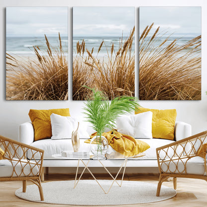 Canvas of golden beach grass swaying by the ocean under a soft cloudy sky, perfect for neutral-toned or coastal minimalist decor.
