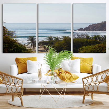 View of calm ocean waves with palm trees and a tropical coastline, ideal for coastal boho or beach-themed wall decor.
