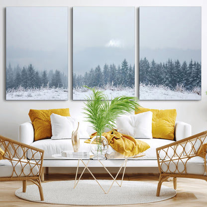 Snow-covered forest under misty sky, soft light breaking through clouds, ideal for minimalist or Nordic-inspired home decor.