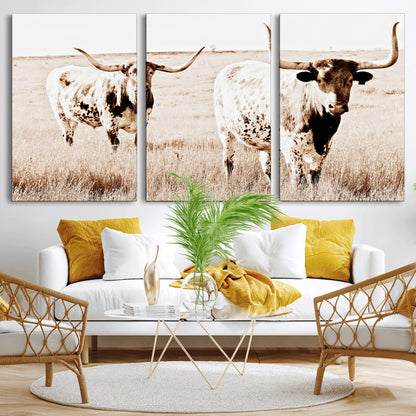 Two Texas longhorn cows standing in a sepia-toned pasture, evoking rustic charm perfect for farmhouse or western country interiors. (