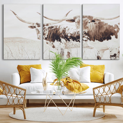 Two longhorn cows standing in a sepia-toned pasture with soft light, ideal for rustic or farmhouse-themed neutral wall decor.
