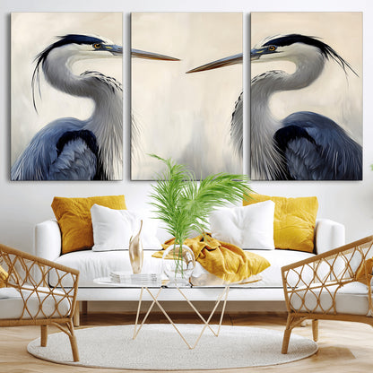 Two blue herons facing each other on a soft neutral background, ideal for coastal, tranquil, or nature-inspired minimalist interiors.