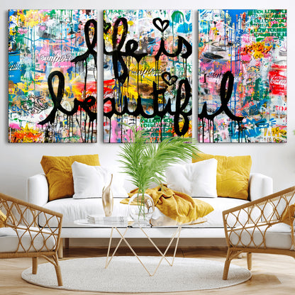 Colorful urban-style canvas with graffiti text “Life is Beautiful” in black paint, ideal for bold or street-themed home decor.