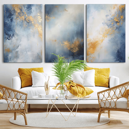 Abstract canvas art in soft blue and gold tones with textured brushstrokes, ideal for elegant or modern neutral decor spaces.