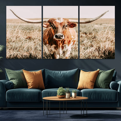 Framed longhorn cow canvas wall art with rustic prairie background, western animal print perfect for farmhouse or ranch style decor