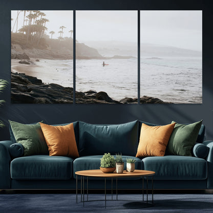 Framed canvas of a surfer in misty coastal tones at a foggy California beach, ideal for minimalist coastal beach or serene ocean-themed decor.