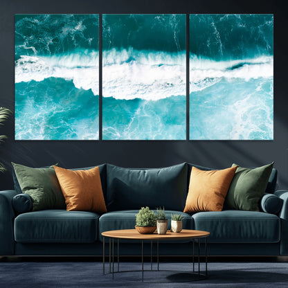 Aerial view of turquoise ocean waves crashing with white foam, perfect for tropical coastal or modern beach-style home decor.