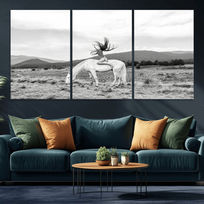 Black and white photo of a woman on a white horse in moody tones, ideal for Western Boho or modern rustic-style home decor.