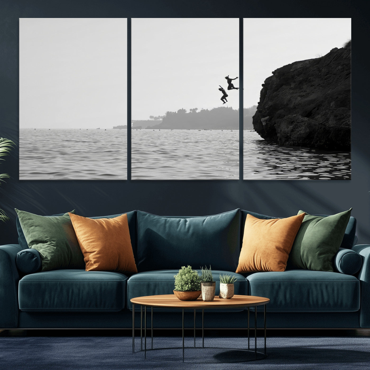Black and white canvas of two figures cliff jumping into the sea, captured with moody tones, ideal for modern coastal or adventure-themed home decor.   2/2