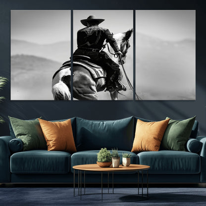 Black and white canvas of a cowboy on horseback with moody tones, perfect for rustic western or country-inspired home decor.