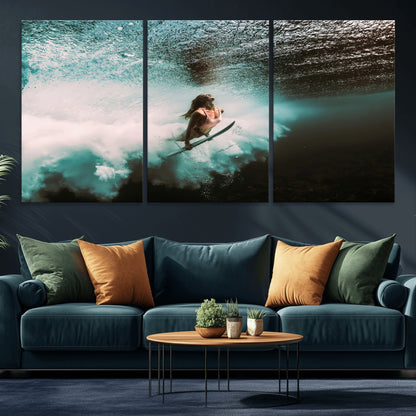 Vibrant underwater photo of a female surfer diving through turquoise waves, perfect for coastal boho or surf-inspired home decor.