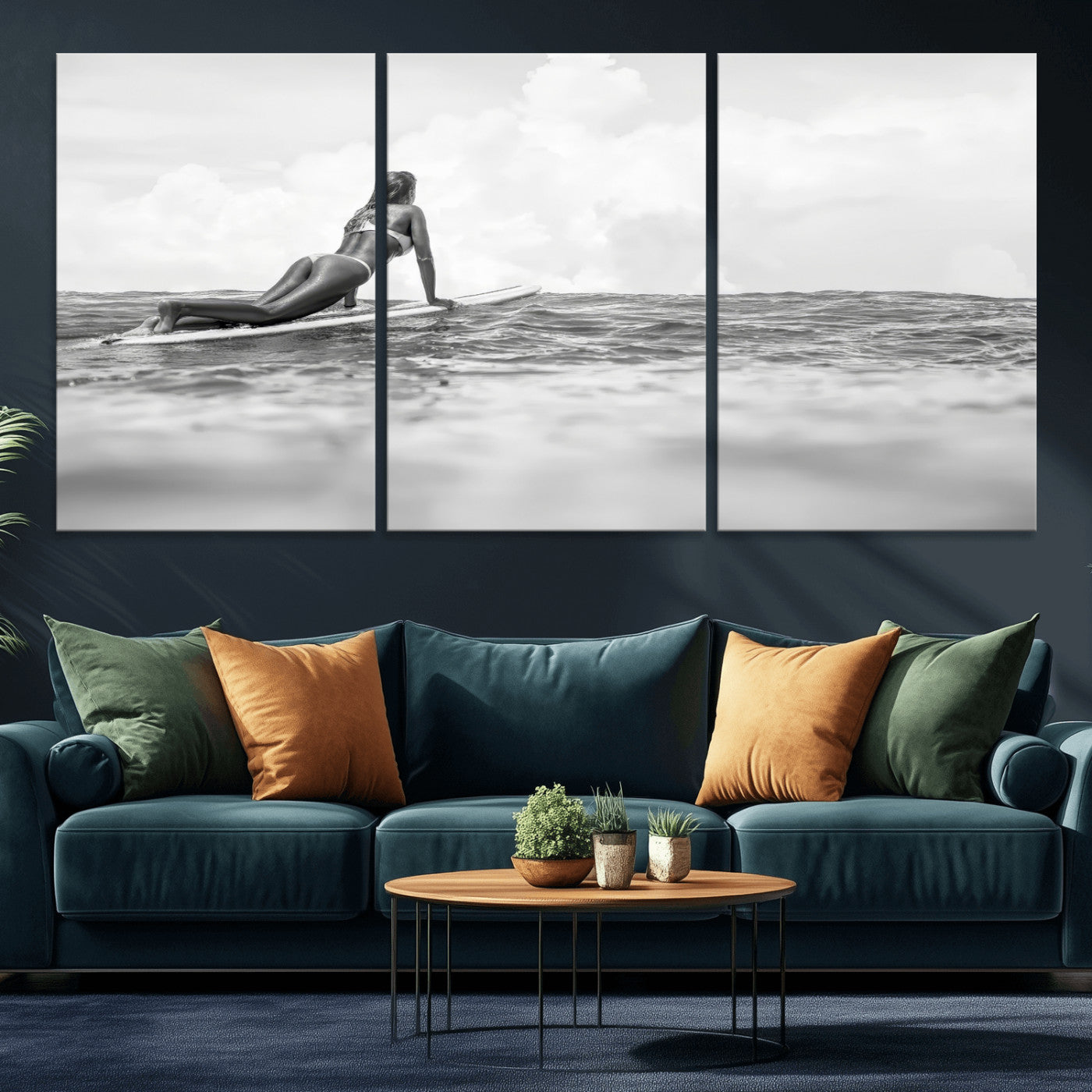 A black and white ocean scene featuring a surfer girl waiting on her board, gazing at the horizon, capturing a tranquil and adventurous coastal moment.