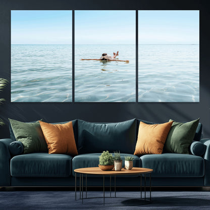 A peaceful minimalist scene of a person floating on crystal-clear water, surrounded by a vast open horizon, capturing relaxation and serenity in a tranquil aquatic setting.