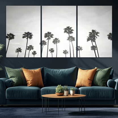 A black and white minimalist scene featuring tall palm trees silhouetted against a bright sky, creating a dreamy and timeless tropical aesthetic.