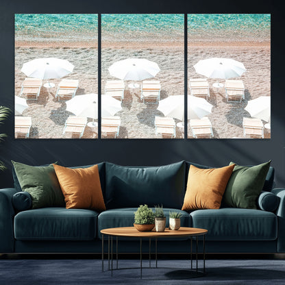 A bright beach scene with white umbrellas, pastel sand, and turquoise waters, creating a tranquil coastal vibe, perfect for beach house or summer decor.