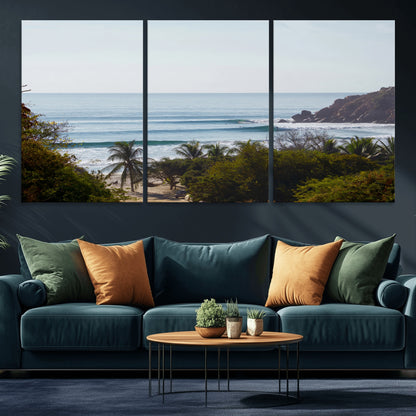 View of calm ocean waves with palm trees and a tropical coastline, ideal for coastal boho or beach-themed wall decor.