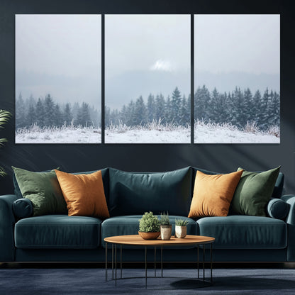 Snow-covered forest under misty sky, soft light breaking through clouds, ideal for minimalist or Nordic-inspired home decor.