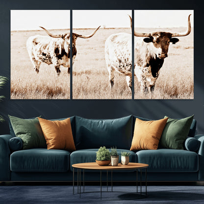 Two Texas longhorn cows standing in a sepia-toned pasture, evoking rustic charm perfect for farmhouse or western country interiors. (