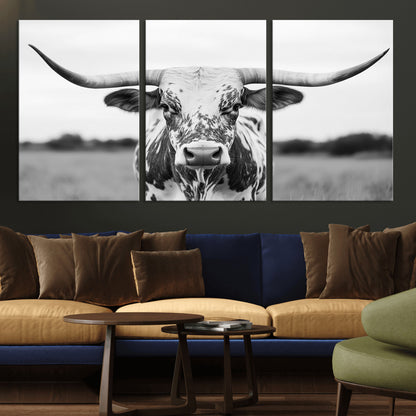 Capture the strength and elegance of nature with this striking black and white portrait of a longhorn cow. Its powerful presence makes a bold statement in any room.
