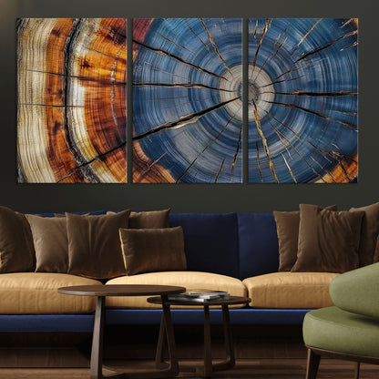 A stunning close-up view of a tree trunk, showcasing the intricate growth rings in a vibrant mix of warm browns, cool blues, and hints of natural texture.