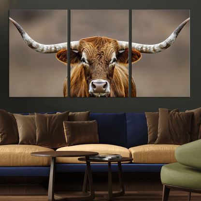 Close-up of a Texas Longhorn with strong curved horns and warm brown tones, perfect for rustic or western-style wall decor.