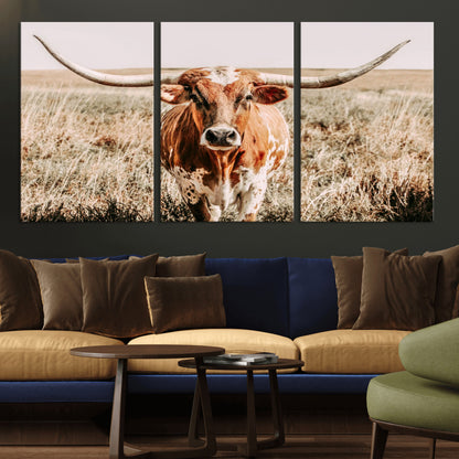 Framed longhorn cow canvas wall art with rustic prairie background, western animal print perfect for farmhouse or ranch style decor