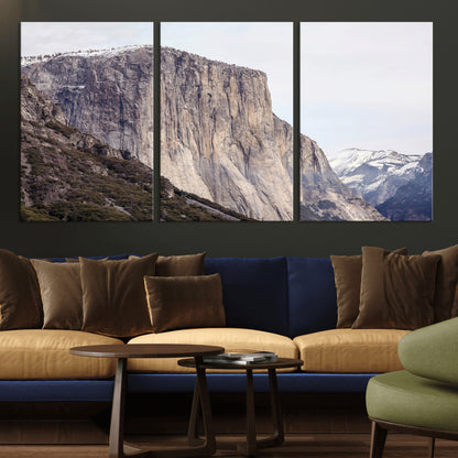 Framed canvas of El Capitan’s vertical granite face in Yosemite with snowy peaks, ideal for Sierra minimalism or mountain-inspired decor.